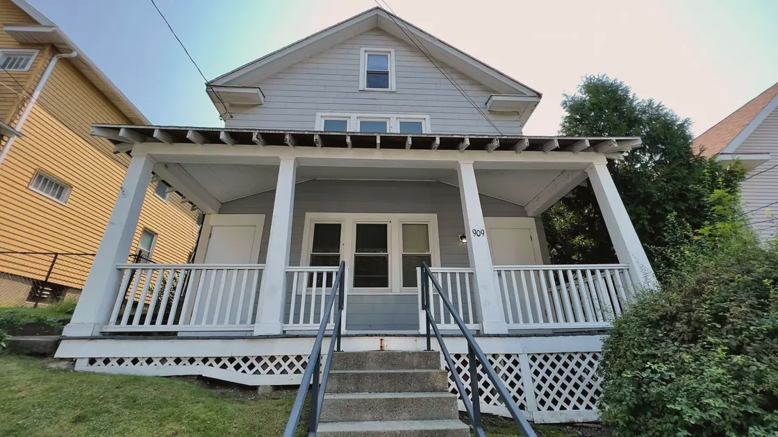 The grey house with the white porch in Jacksonville, where my parents lived when I was born.